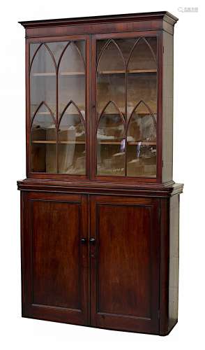 Property of a lady - a mahogany two-part bookcase, the early 19th century George IV top with tracery