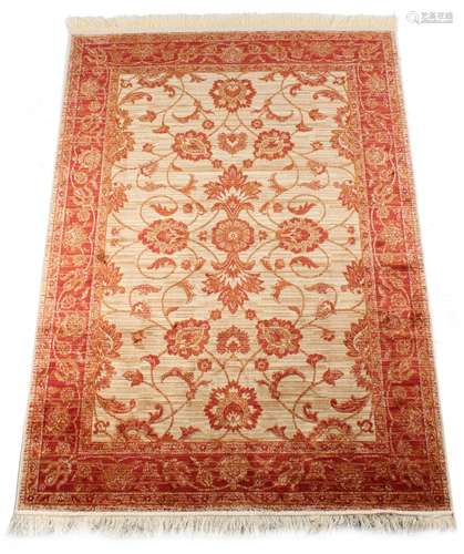 A Ziegler style rug with beige ground, 75 by 53ins. (190 by 135cms.) (see illustration).