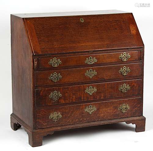 Property of a deceased estate - an 18th century George III oak fall-front bureau, with four long