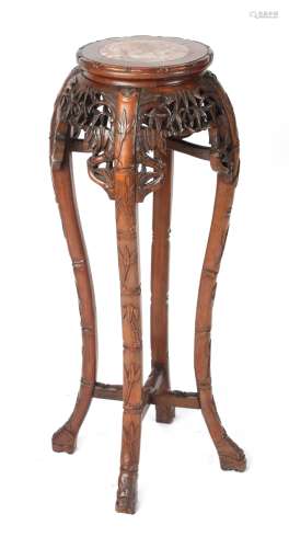A late 19th / early 20th century Chinese carved hardwood stand with pink marble inset top, 36ins. (
