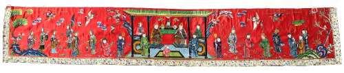 A Chinese embroidered red silk long panel depicting a court scene, late 19th / early 20th century,