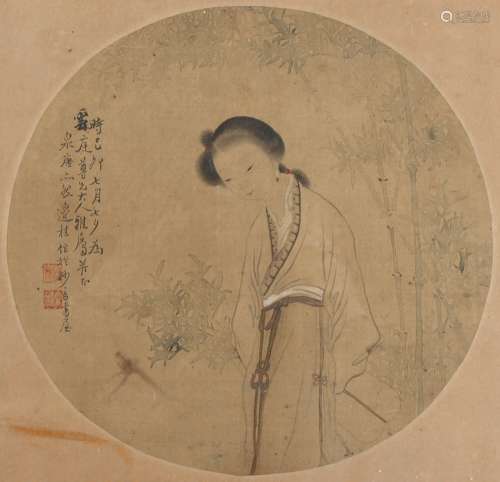 A late 19th century Chinese painting on circular silk panel depicting a lady by bamboo, with