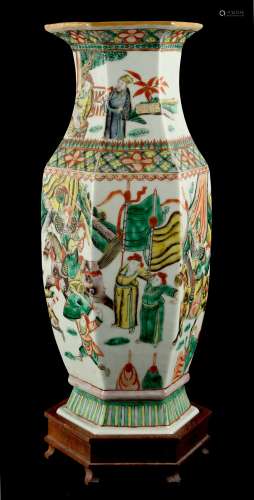 A late 19th century Chinese famille verte hexagonal baluster vase, painted with warriors in