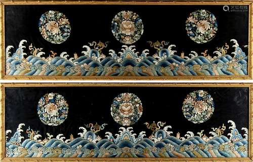 A pair of Chinese embroidered silk panels depicting floral roundels above waves, late 19th / early