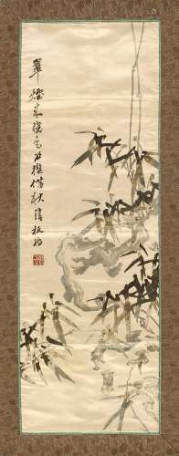 A Chinese Republic period embroidered silk panel depicting bamboo, with embroidered calligraphy &