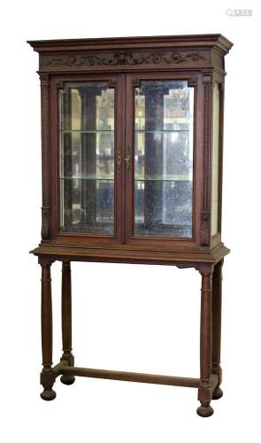 Property of a gentleman - a late 19th century French carved walnut china display cabinet on stand,
