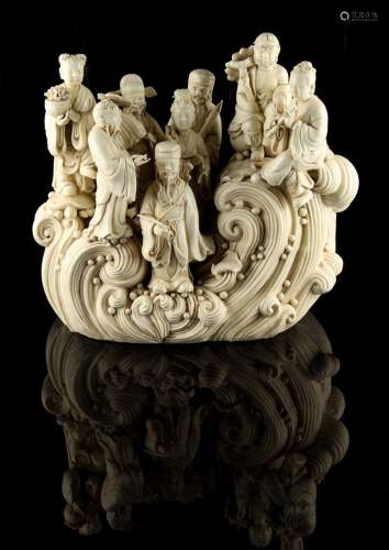 A large Chinese blanc de chine group of the Eight Immortals on waves, 13.2ins. (33.5cms.) high (