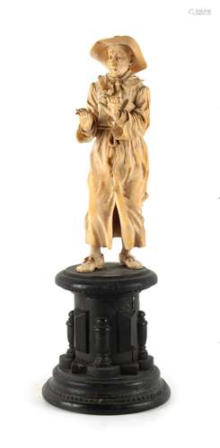 Property of a lady - a late 19th century Continental carved ivory figure of a standing missionary,