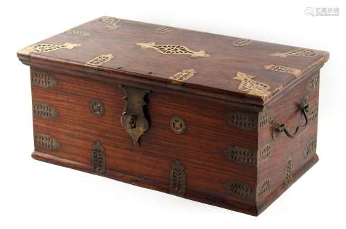 An Indian hardwood box with pierced brass mounts, 17ins. (43cms.) wide (see illustration).