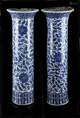 A large pair of Chinese blue & white sleeve vases, 19th century, painted with scrolling lotus,