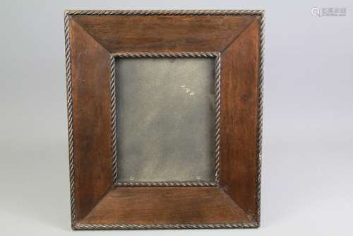 An Ebony Effect Carved Picture Frame