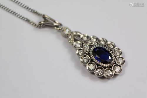 A Platinum Royal Blue Sapphire and Diamond Tear Drop Form Pendant
