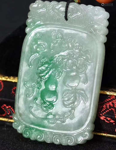 A JADEITE CARVED AUSPICIOUS PATTERN PENDANT