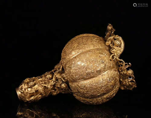 A GILT BRONZE CASTED MELON SHAPED CANDLE HOLDER