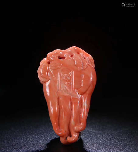 A RED CORAL CARVED CHAYOTE SHAPED PENDANT