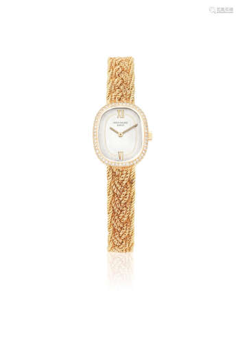 Ellipse, Ref: 4498/2, Circa 1960  Patek Philippe. A lady's 18K gold and diamond set manual wind bracelet watch