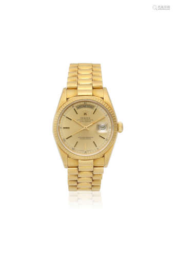 Day-Date, Ref: 18028, Sold 23rd September 1987  Rolex. An 18K gold automatic calendar bracelet watch