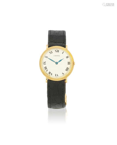 Circa 1950  Cartier. A mid-size 18K gold manual wind wristwatch