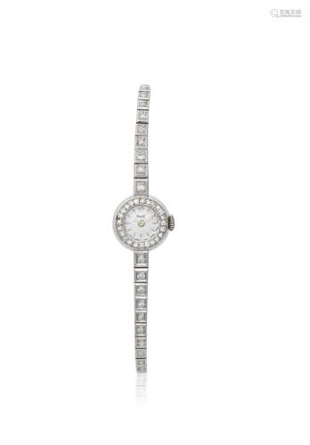 Circa 1980  Piaget. A lady's 18K white gold and diamond set manual wind bracelet watch