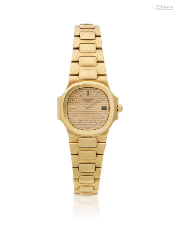 Nautilus, Ref: 4700/001, Sold 27th July 1984  Patek Philippe. A lady's 18K gold quartz calendar bracelet watch