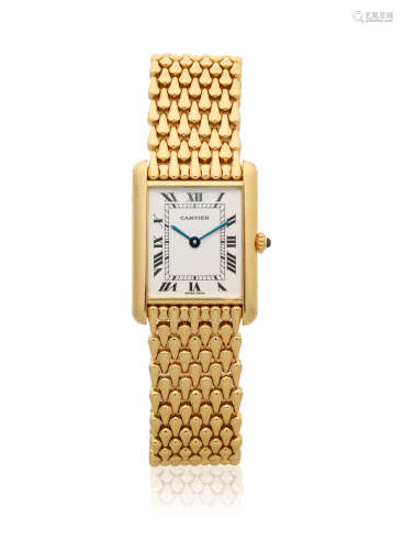 Tank, Ref: 1140 2, Circa 1990  Cartier. An 18K gold quartz rectangular bracelet watch