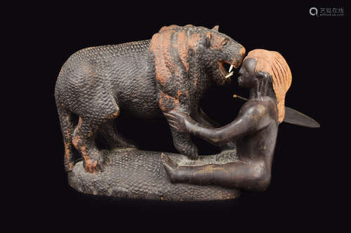 An African Hardwood Sculpture of Lion Hunter