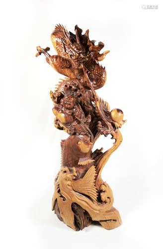 A Chinese Old Boxwood Carved Laughing Buddha and Dragon Statue