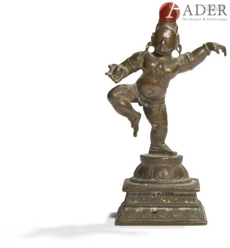 INDE - XVIIIe/XIXe siècle Petite statuette de Krishna en bronze, debout sur une jambe sur le
