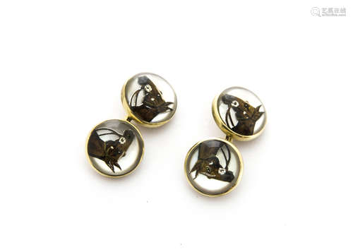 A pair of reverse painted rock crystal Essex intaglio cufflinks, modelled as horses heads, mother of