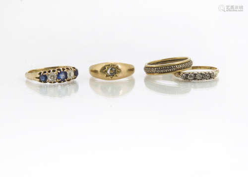Four 18ct gold rings, comprising a five stone diamond and sapphire dress ring, approximate ring size