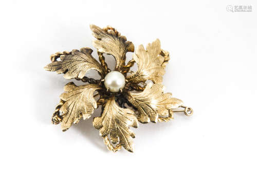 A continental yellow metal and seed pearl brooch or pendant, the central pearl surrounded by six