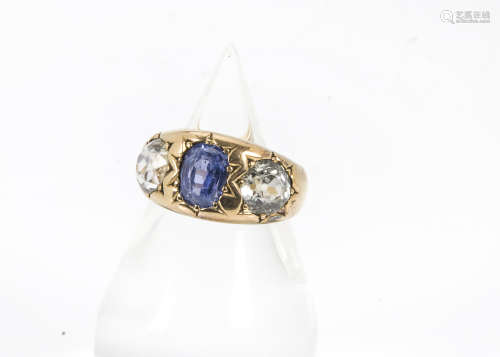 A late Victorian 15ct gold sapphire and zircon ring, the heavy thick tapering band set with a pair