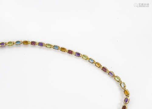 A modern 14ct gold and gem set bracelet, the line links set with garnets, peridots and citrines,