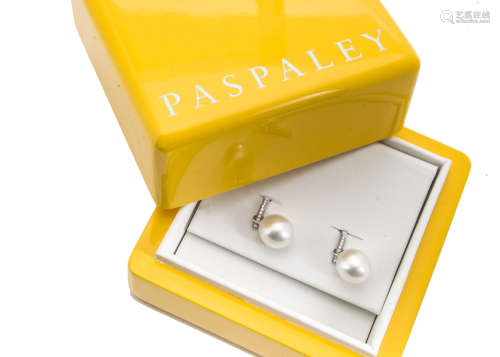 A pair of Paspaley cultured pearl and diamond drop earrings, the large oval cultured white pearls on