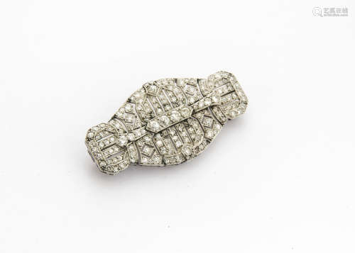 An art deco diamond and platinum brooch, of architectural ovoid form, the old cut stones in