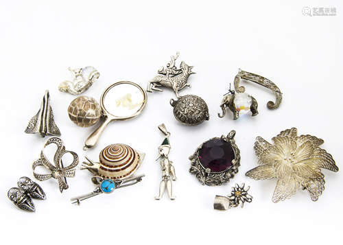 A collection of silver charms and other white metal jewellery, including a Chester hallmarked