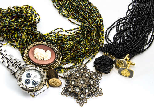 A large quantity of costume jewellery, including a pair of paste set cuff earrings, various beads