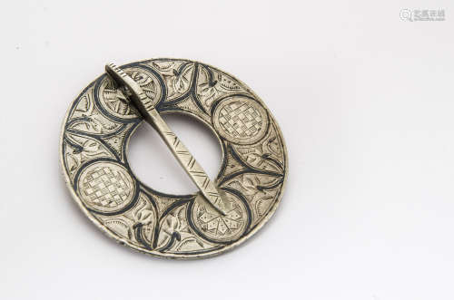 An 18th Century Scottish silver Plaid brooch, the circular niello work decoration with engraved