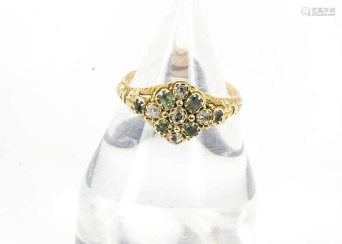 An antique gold and gem set posy style ring, the shaped tablet with emeralds and rough cut diamonds,