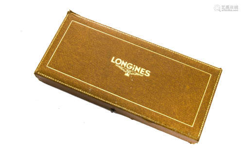 A vintage Longines watch box, brown leatherette heightened in gilt, appears to be for a lady's