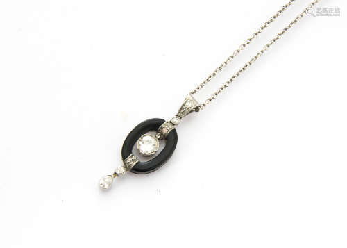 An art deco and onyx diamond drop pendant, the old cut suspended diamond within an onyx oval with