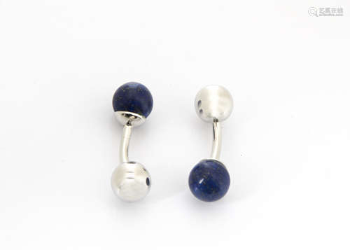 A pair of white metal and lapis lazuli cufflinks, the spherical beads on fixed white metal batons