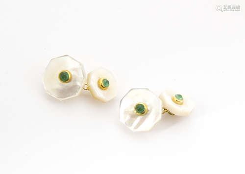 A pair of mother of pearl and emerald cufflinks, the octagonal panels centred with cabochon emeralds