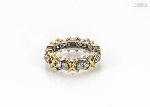 A modern 18ct gold and diamond eternity ring, the white gold band with applied yellow gold crosses