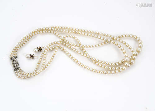 A vintage three strand cultured pearl necklace, with silver and marcasite clasp, together with a