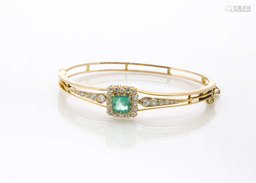 A certified emerald and diamond set gold bangle, the octagonal cut emerald in claw setting