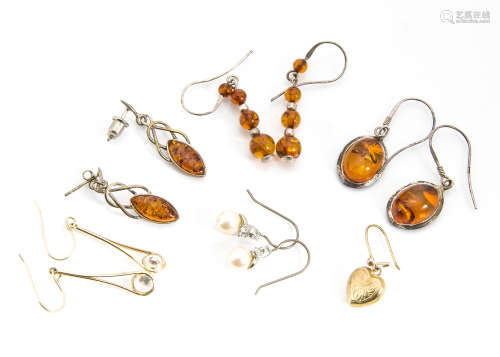 Three pairs of Baltic amber earrings, a pair of paste set gold earrings, a single heart shaped