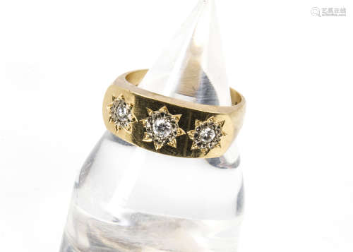 A 1970s 18ct gold and three stone diamond gentleman's signet ring, the brilliant cuts in gypsy