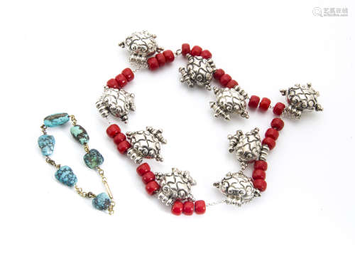 A small collection of Tibetan silver, coral and resin jewels, including a re-strung silver and red