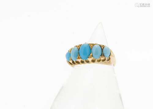 An early 20th Century five stone oval cabochon turquoise gold dress ring, shank stamped 18 with